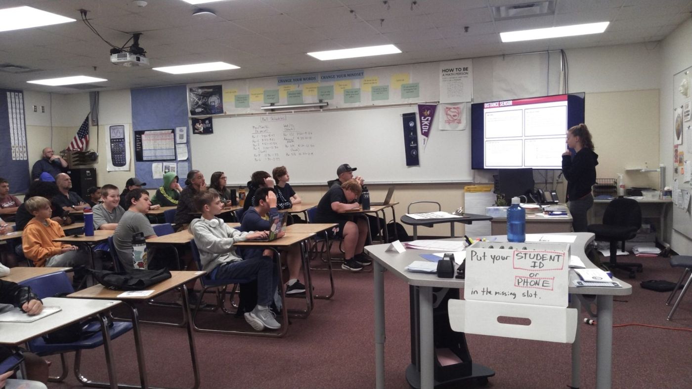 A classroom full of students at an FTC kickoff presentation
